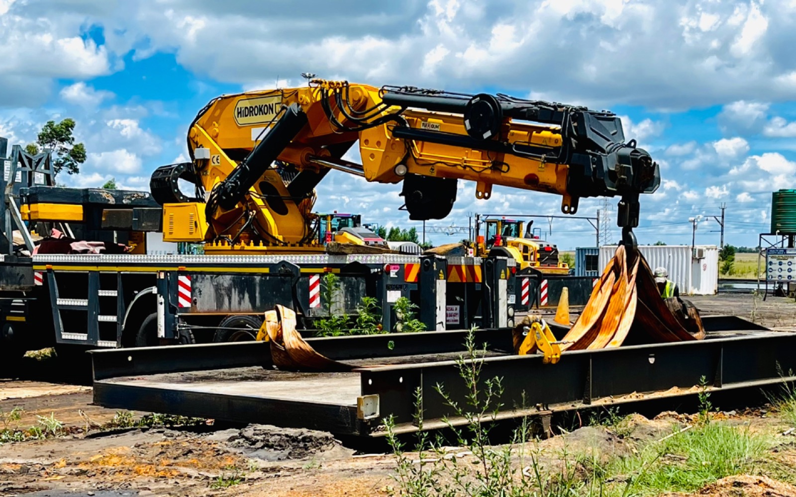Heavy-lift rigging operation — tandem cranes coordinating a vessel placement